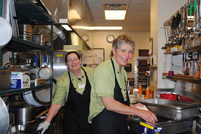 Picture of two female staff in a kitchen smiling